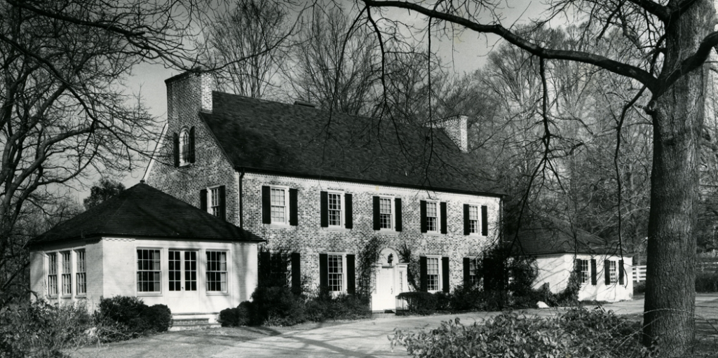 Black and white photo showing exterior view of the Georgian Revival house at 4112 Manor Road