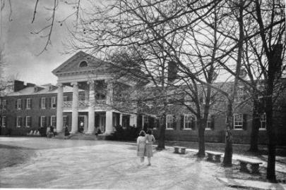 Two Girls hand in hand in front of college