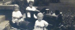 Three Orme Children on riding toys c. 1914