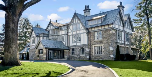 Exterior view of the mansion at 9 Newlands Circle showing a Tudor revival facade