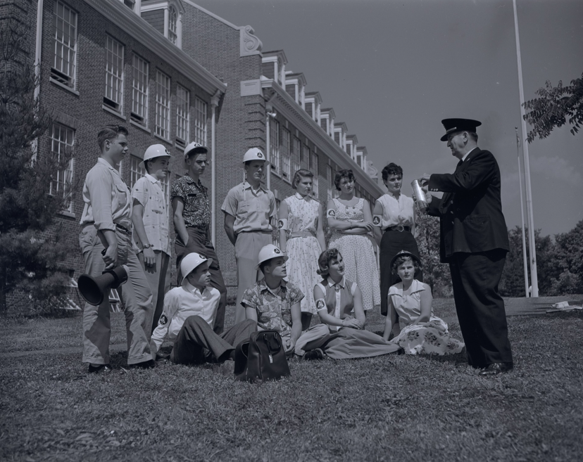Join the Chevy Chase Historical Society for a special centennial program on Sunday, November 1, at 3 p.m. at Bethesda-Chevy Chase High School (4301 East-West Highway, Bethesda, MD) with museum exhibit developer Lucy Harvey, as she explores the remarkable history of B-CC and the milestones that have shaped its first century. Founded in 1926 as a segregated neighborhood school on former farmland, B-CC has transformed into a diverse, urban high school serving students from 55 countries. From presidential visitors and groundbreaking nuclear disaster planning to voluntary desegregation and student exchanges with the Soviet Union, the school’s history offers a unique window into a century of change in American education. Harvey will discuss the development of the new Centennial Museum and guide visitors through the exhibit. Harvey has developed exhibitions and digital content for institutions including the Smithsonian’s National Museum of American History and the Discovery Channel. She studied history at Dartmouth College, earned a master’s in journalism from Columbia University, and holds a certificate in Museum Studies from George Washington University. The program is free and open to the public. Please use the doors closest to the cafeteria when entering B-CC for this event. For more information, contact the Chevy Chase Historical Society at 301-656-6141 or info@chevychasehistory.org. 📸Unpublished photograph of the B-CC nuclear bomb drill taken during a 1954 photo shoot for the Saturday Evening Post article titled “This School is Ready for the H-bomb.” Courtesy of the Oliver Atkin Collection, 0036, Box 54, Folder 118, Image 37, Special Collections Research Center, George Mason University Libraries.